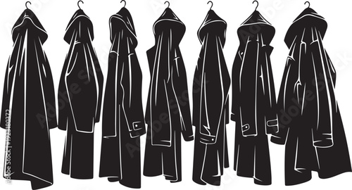 Collection of black coats hanging on hooks in row