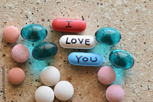 Colorful Pills Spelling I Love You With Heartfelt Message On Medicine Capsules. Prescription drug addiction in America.