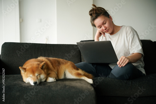 Working on Laptop With Dog