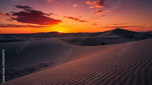 Serene sunset over rolling sand dunes, highlighting vibrant colors and tranquil atmosphere
