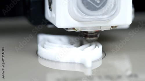 3D Printer Creating White Plastic Object.
