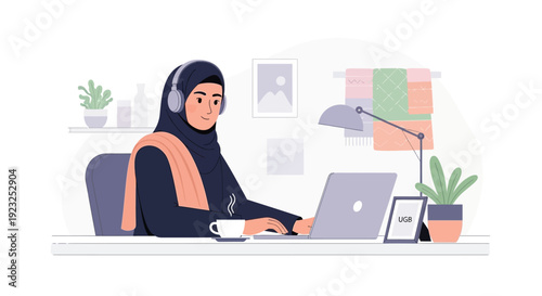 Young Muslim woman wearing hijab and headphones working on laptop at home office desk