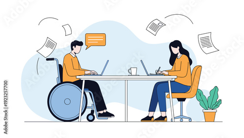 Two professional colleagues including a man in a wheelchair and a woman working together at a shared table with laptops and flying papers.