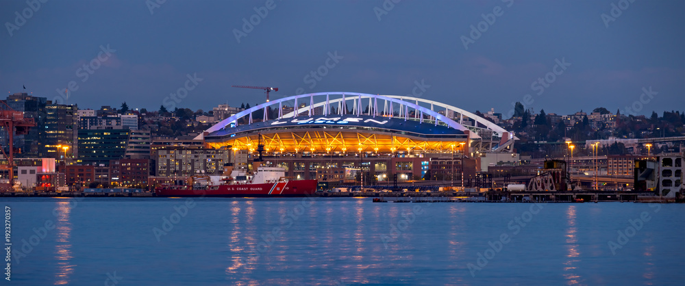 Naklejka premium Lumen Field and Seattle skyline reflecting in Puget Sound