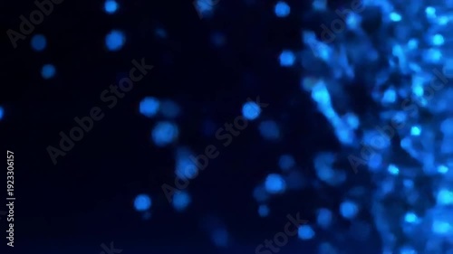 Abstract blue bokeh lights gently float and shimmer against a dark, atmospheric background, creating a dreamy