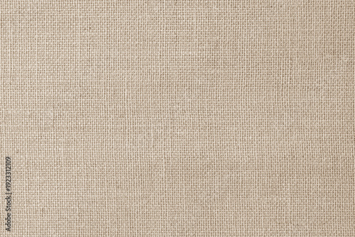 Jute hessian sackcloth woven hemp burlap gauze fibre fabric textile texture background in sepia cream old aged brown color