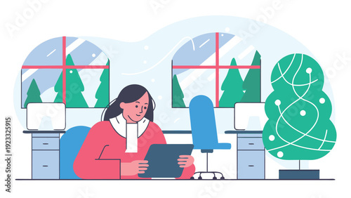 A woman sits at her office desk, working on a digital tablet with a festive Christmas tree nearby.