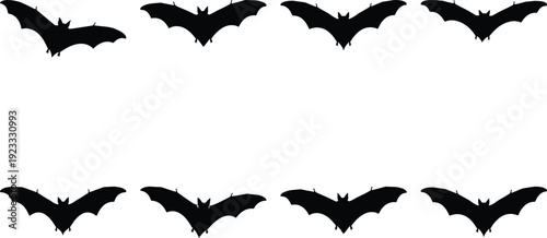 Silhouettes of bats flying in symmetrical formation against a plain background