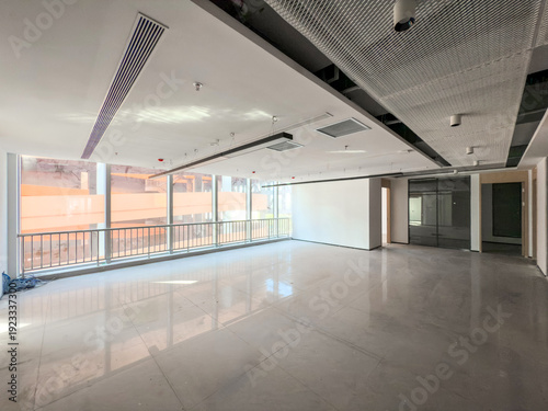 Spacious Modern Office Interior with Abundant Natural Light and Minimalist Design