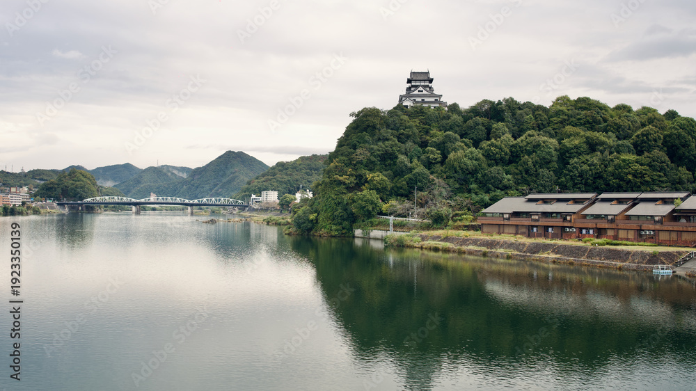 Fototapeta premium Inuyama Castle on hill in a cloud day