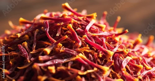 Close-up of vibrant red saffron threads piled together, showcasing their texture and color