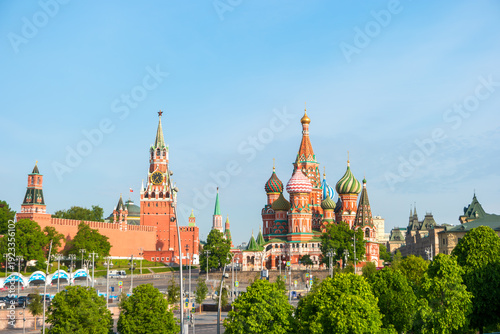 Moscow, Russia - May 16, 2025: Spasskaya Tower and St. Basil's Cathedral (Pokrovsky Cathedral) view from Zaryadye Park. Sunny spring morning