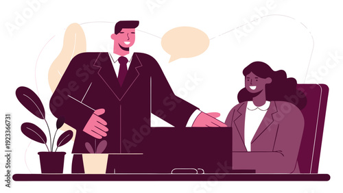 A businessman stands over a desk, gesturing and talking to a businesswoman sitting opposite him for an interview.