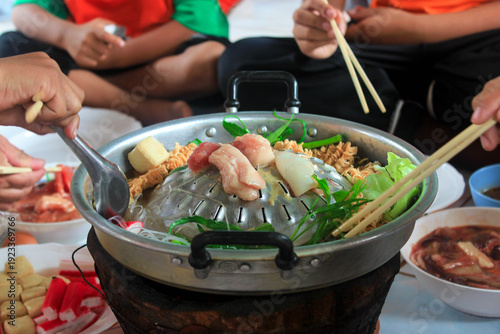 Grilled meat cooked over charcoal.
