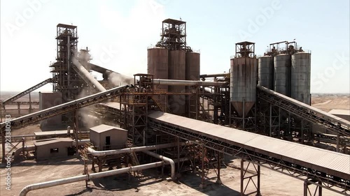 Large industrial factory with conveyor belts and smokestacks