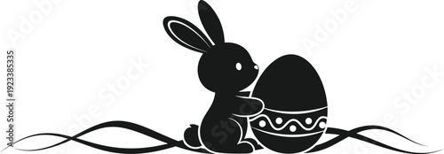 Adorable Easter bunny sitting with decorated egg and ribbons