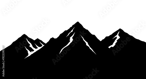 Mountain Peaks Silhouette Against White Sky.