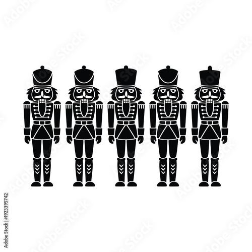 Silhouette of toy nutcracker soldiers standing in a row on a white background.