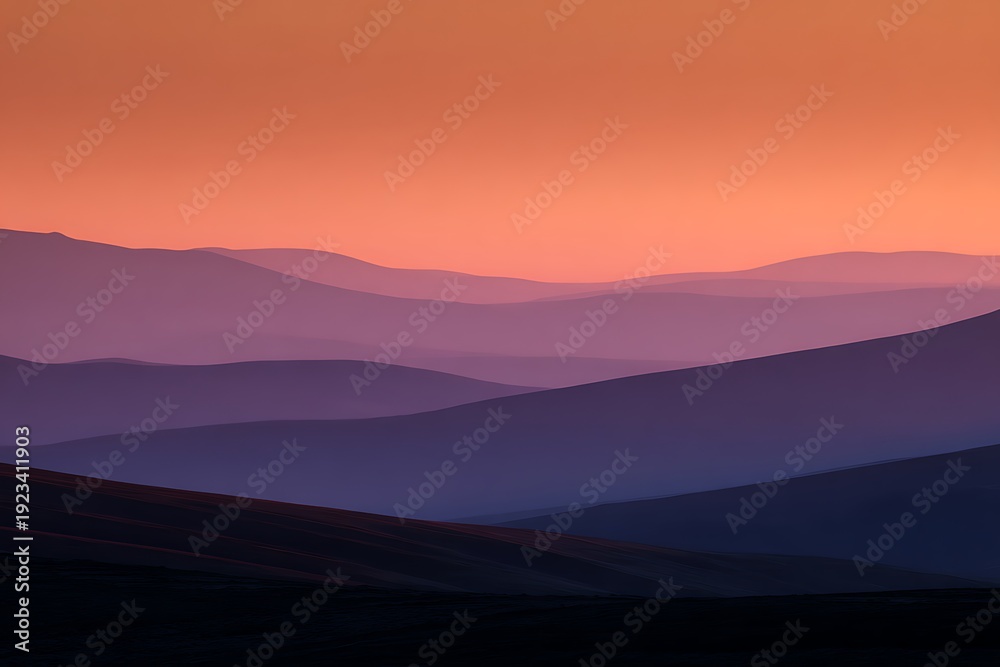Obraz premium Layered mountains creating colorful sunset landscape