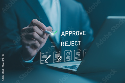 Businessman approving digital documents on a laptop, electronic contract. Business authorization concept, approve and reject icon options. standard quality stamp, acceptance, corporate compliance
