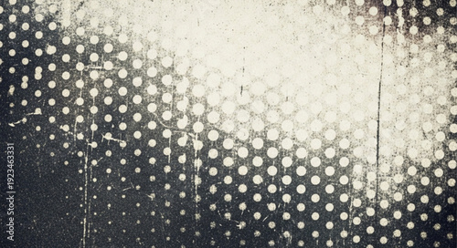 Abstract pattern of dots and light on textured surface.