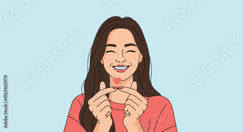 Happy woman with long dark hair making a small heart gesture with her fingers representing love and affection.