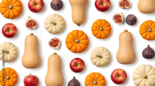 Autumn harvest flat lay with orange pumpkins, white gourds, butternut squash, red apples, and purple figs on a white background