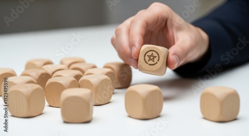 Strategic differentiation and highlighting a unique cube separate from the rest using wooden cubes, symbolic icons, human hand, natural depth of field, soft blurred background, clean white desk.