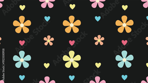 Cheerful seamless pattern displaying scattered colorful flowers in various hues and small hearts on a deep black background, offering a vibrant and playful design.