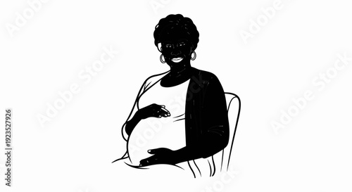 A smiling pregnant woman sits in a chair, cradling her belly with her hands