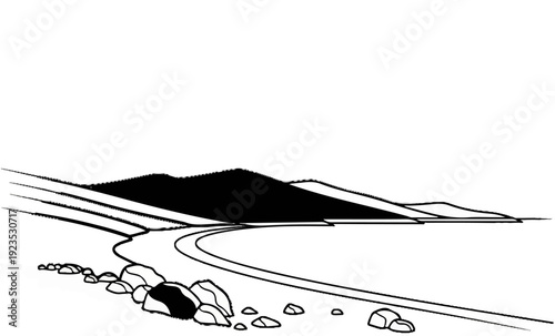 A winding road leads through a rocky landscape towards distant, dark mountains