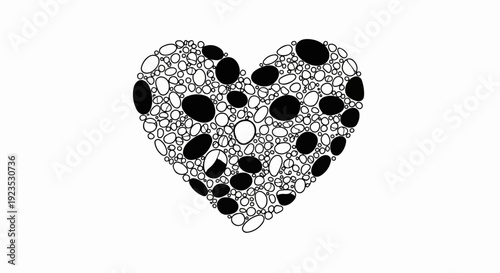 A heart shape composed of many small, round and oval pebbles, some filled in black