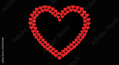 A heart shape is formed by many small red hearts on a black background