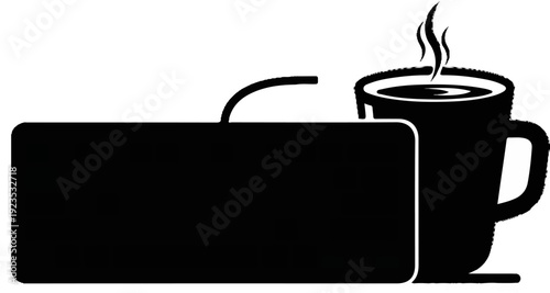 A hot cup of coffee sits next to a computer keyboard