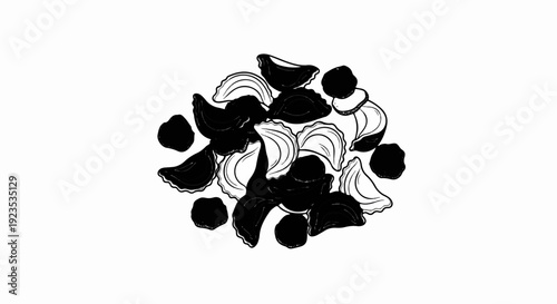 A pile of black and white pasta shells and dark dots