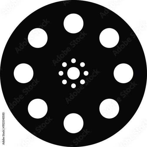 silhouette vintage film reel with circular perforations and central hub vector design