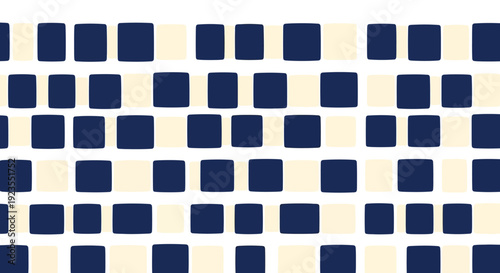 A close-up view of a repeating pattern of dark blue and cream-colored squares.
