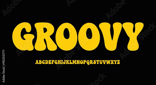 A bold, yellow, bubbly "Groovy" font displayed prominently against a stark black background, with the alphabet shown below.