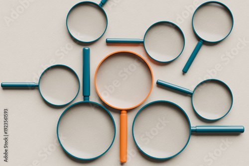 Magnifying glasses representing finding solutions, research, focus, exploration, detailed investigation, and discovery
