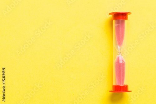 hourglass on the table, sand clock as time passing concept for business deadline, copy space
