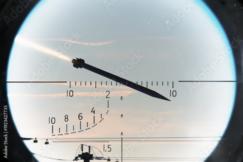 Foto Cruise missile captured by air defense sight against evening sky background