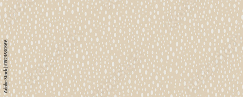 Seamless abstract halftone pattern with scattered oval dots in soft beige and white tones. Light airy textile background.