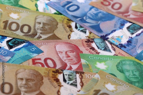 Wallpaper Mural Canadian dollar money bills pile on table. Canada banknotes of CAD currency close up. Torontodigital.ca