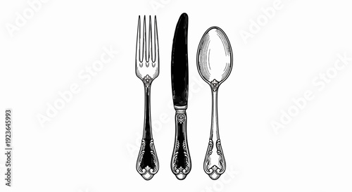 Engraved fork, knife, and spoon with ornate handles on white