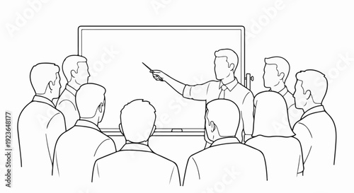 Instructor points to a whiteboard, audience listens attentively in an office setting