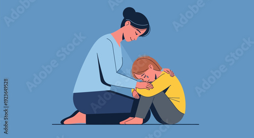 Mother comforting her upset young son.