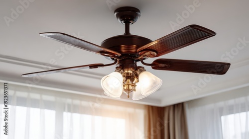 Elegant ceiling fan with warm lights and wooden blades illuminating modern living room interior with curtain and soft natural light in background