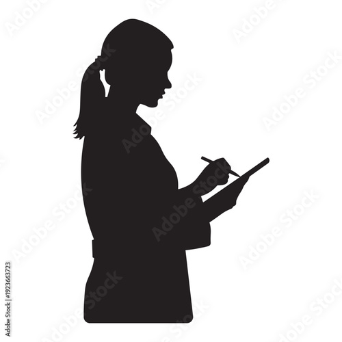 Silhouette of a woman with a stylus on a digital tablet or notepad