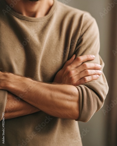 Wallpaper Mural Close view of male torso with folded arms in relaxed posture, representing confidence, waiting or neutral attitude. Torontodigital.ca
