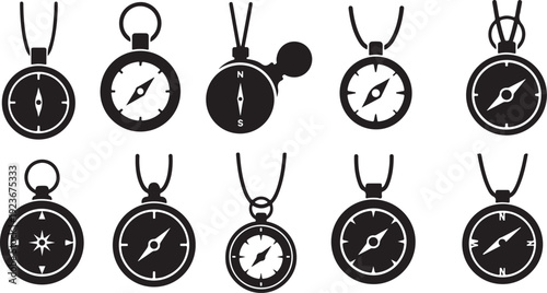 Collection of various black compass pendants on necklaces displayed